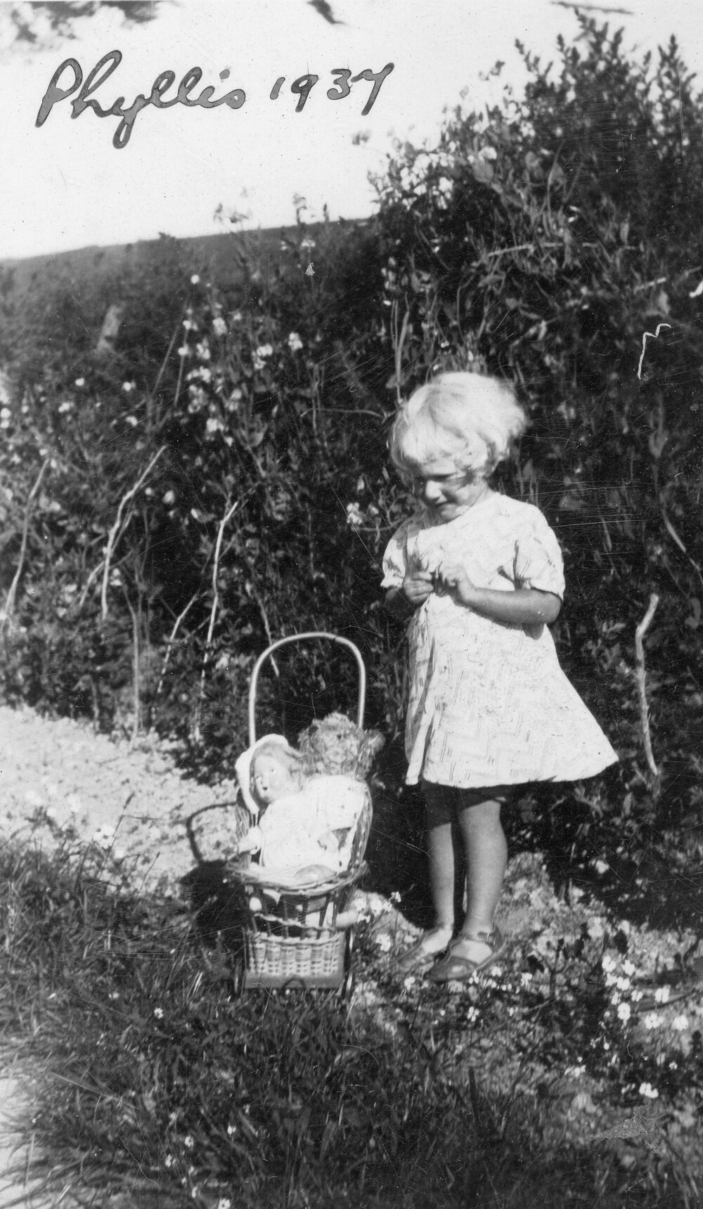 Phyllis Clarke With Doll in Garden