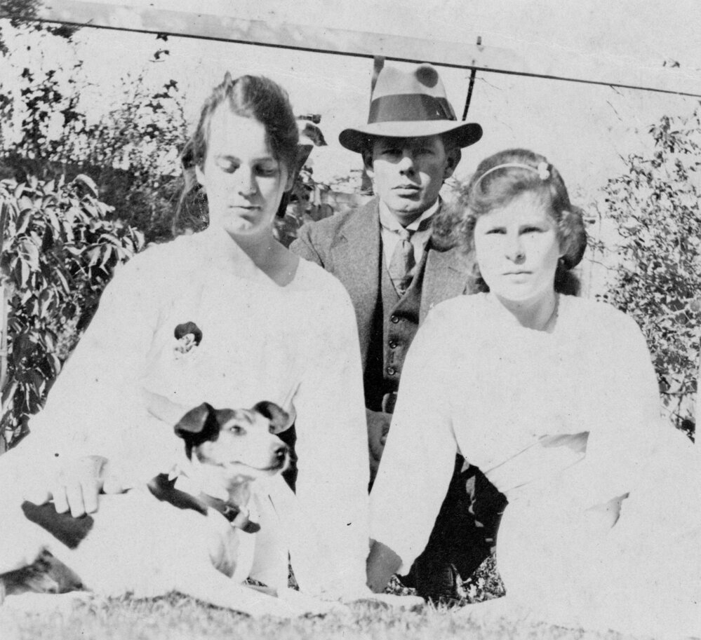 Outdoor Portrait of a Man, Two Young Women and a Dog