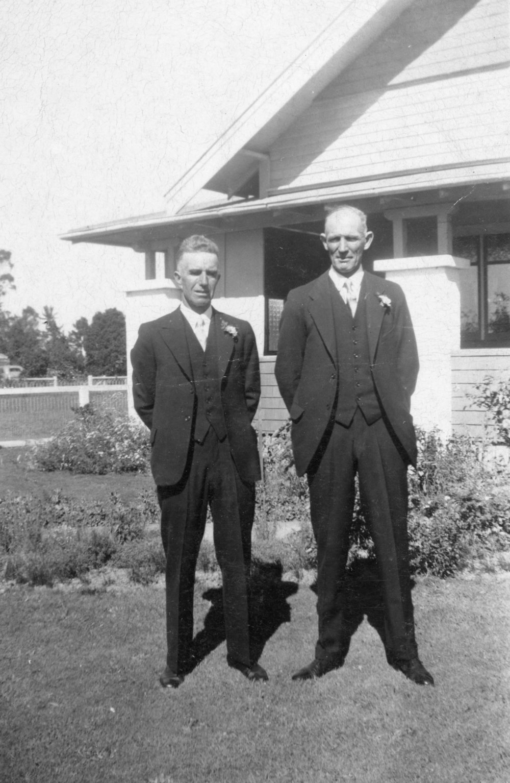 Outdoor Portrait of Two Men in Wedding Suits