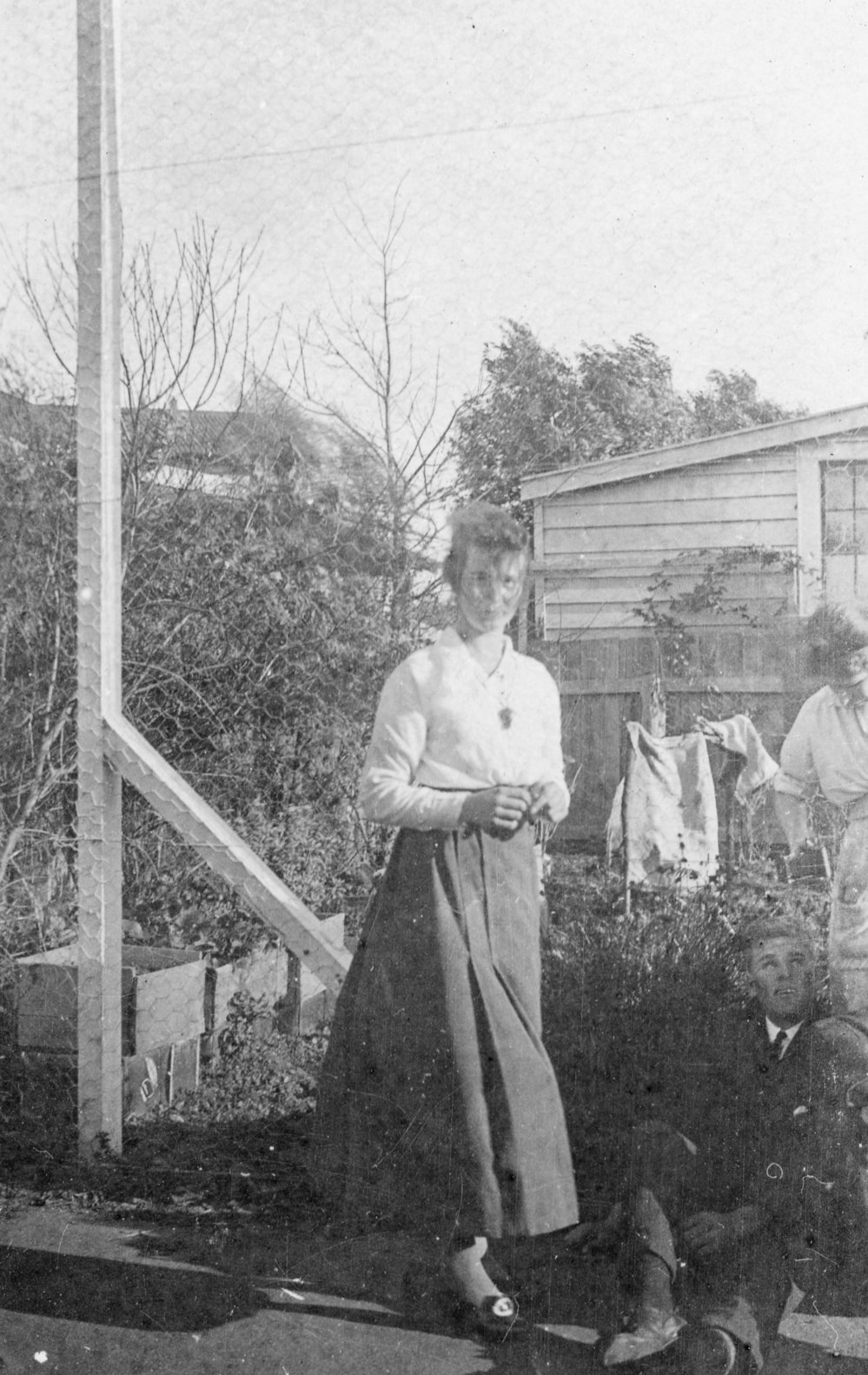 Two Women and a Man in Garden