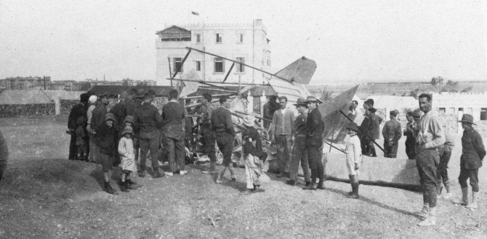 Damaged WWI Plane With Crowd