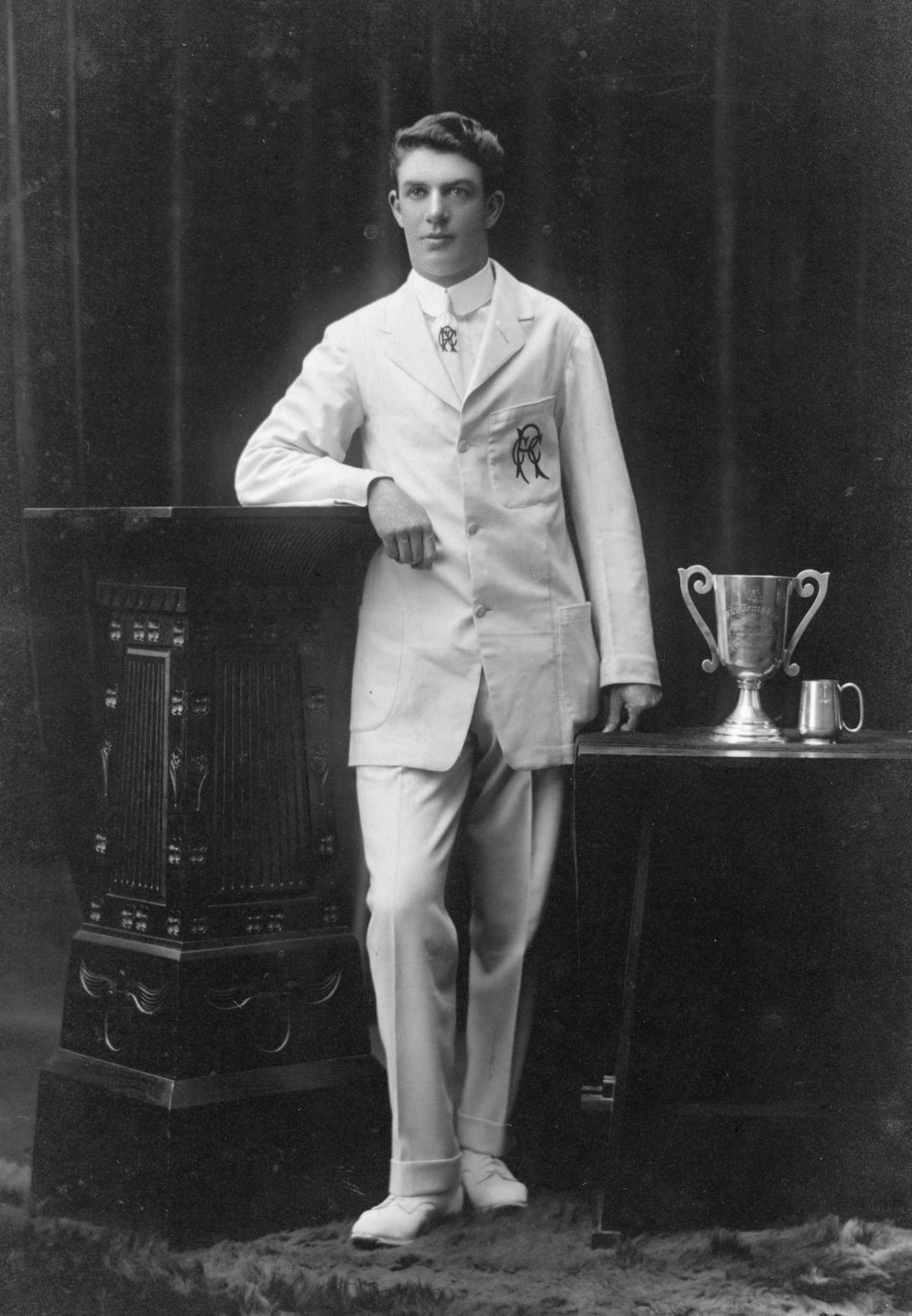 Studio Portrait of Man with Trophies