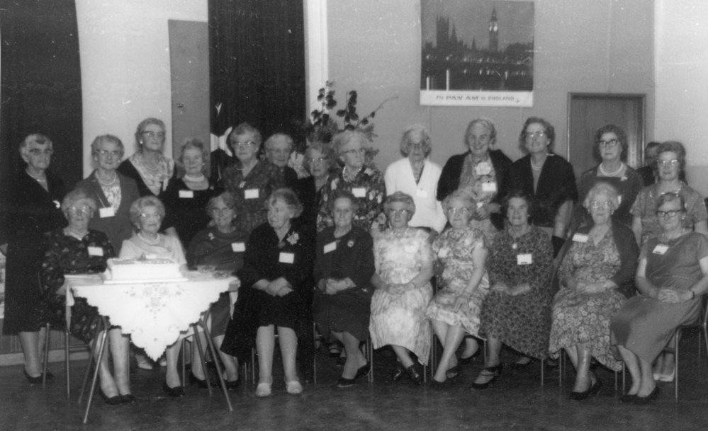 Group Portrait of WDFF Members With Cake