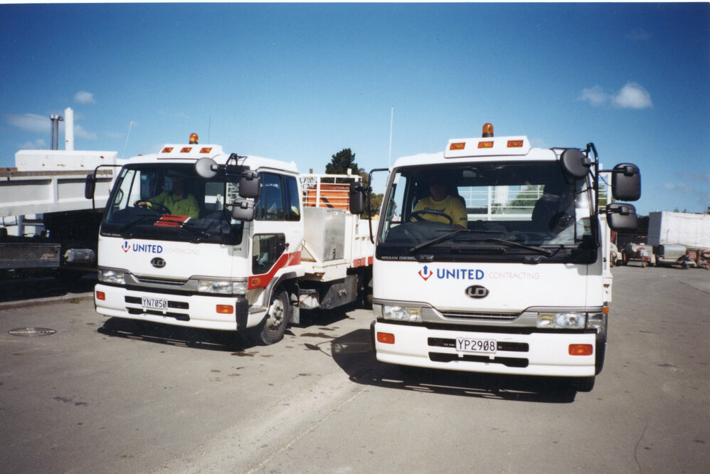 Two Nissan Diesel Trucks