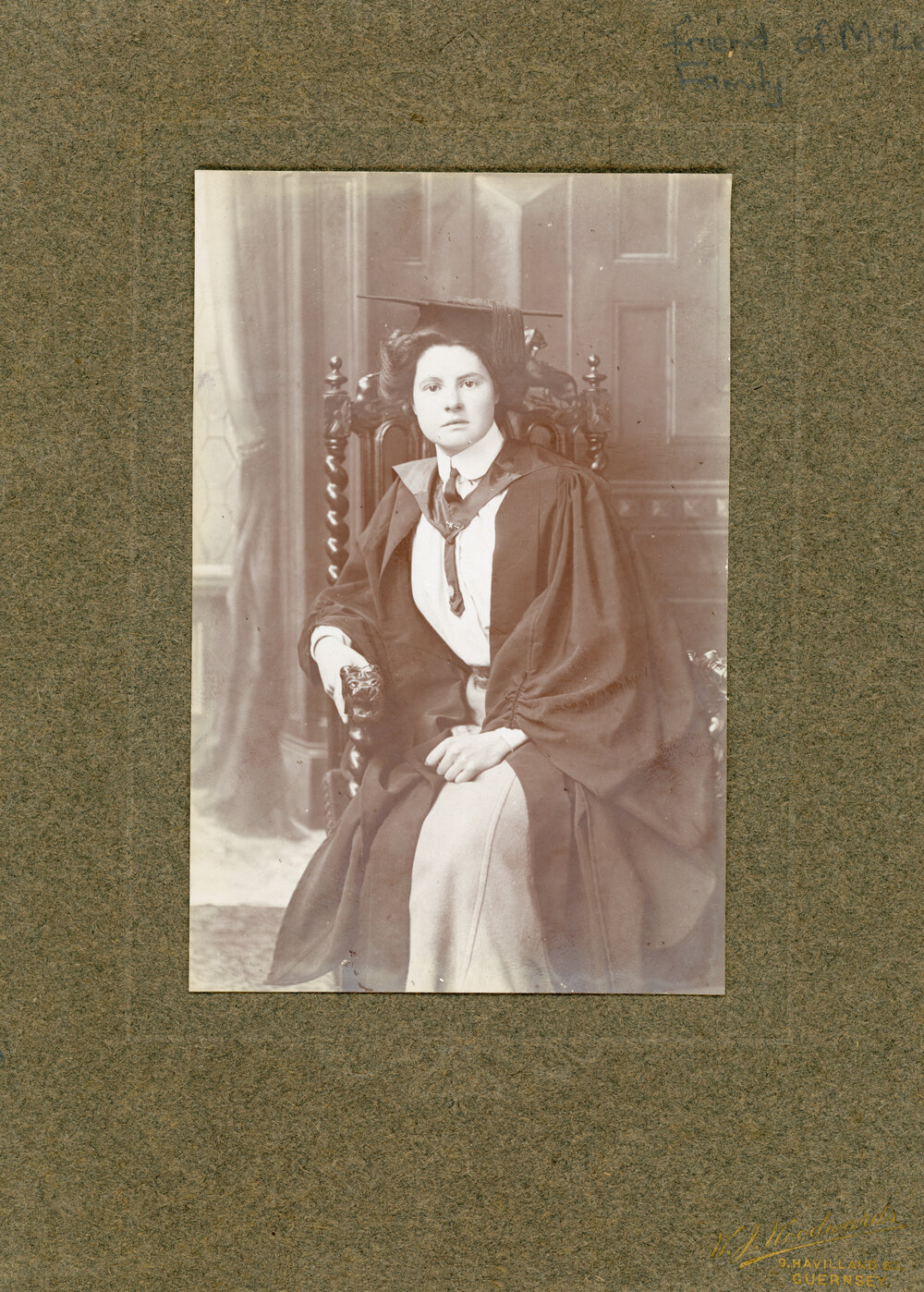 Studio Portrait of Young Woman in Cap and Gown