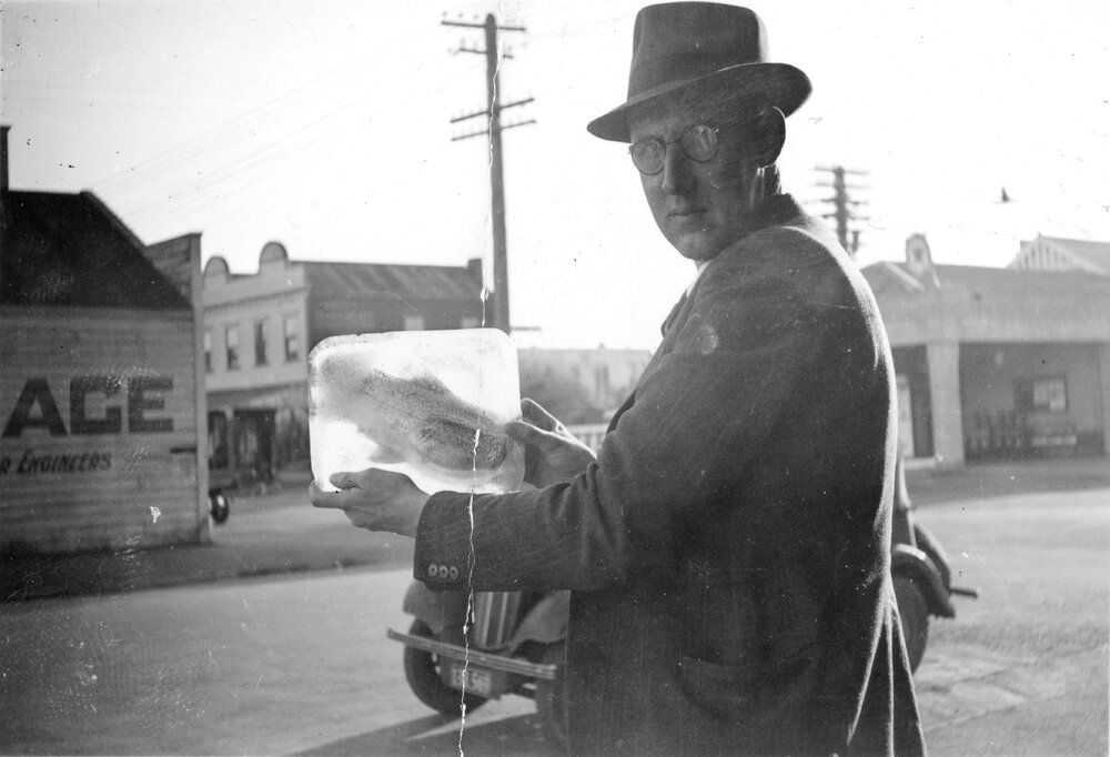 Man with Fish Frozen in Ice