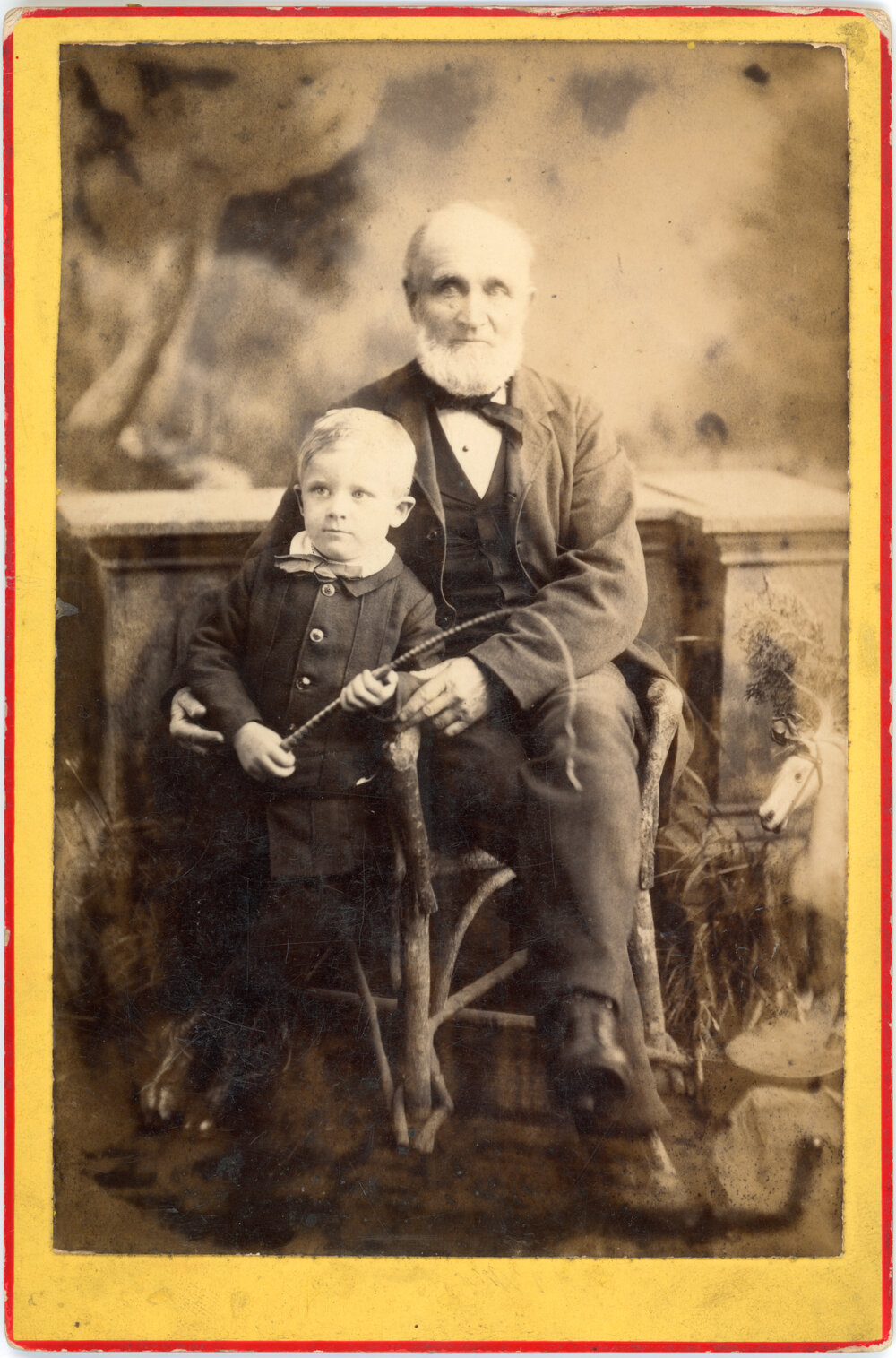 Studio Portrait of Young Boy with Elderly Man