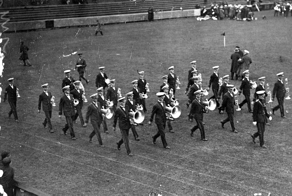 Brass Band Marching at Sports Ground