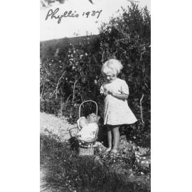 Phyllis Clarke With Doll in Garden