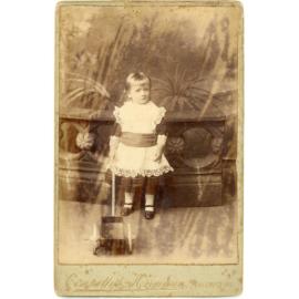 Studio Portrait of Young Child with Push Toy
