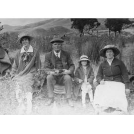 Outdoor Family Portrait with Man Holding Gun