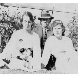 Outdoor Portrait of a Man, Two Young Women and a Dog