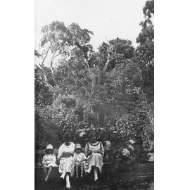 Women and Girls on a Park Bench