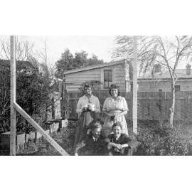 Portrait of Two Women and Two Men in Garden