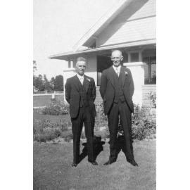 Outdoor Portrait of Two Men in Wedding Suits