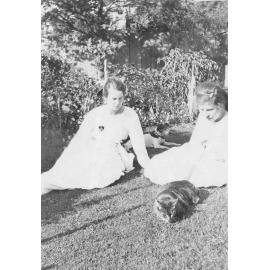 Outdoor Portrait of Two Girls with Pets