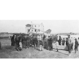 Damaged WWI Plane With Crowd