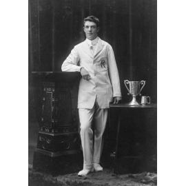 Studio Portrait of Man with Trophies