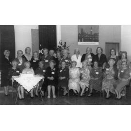 Group Portrait of WDFF Members With Cake