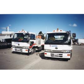 Two Nissan Diesel Trucks
