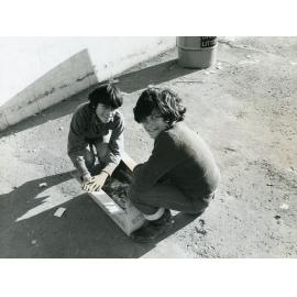 Boys Collecting Bottles