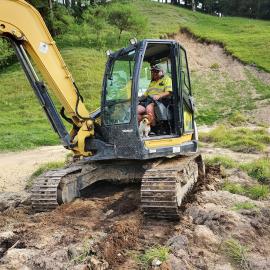 Digger Clearing Driveway