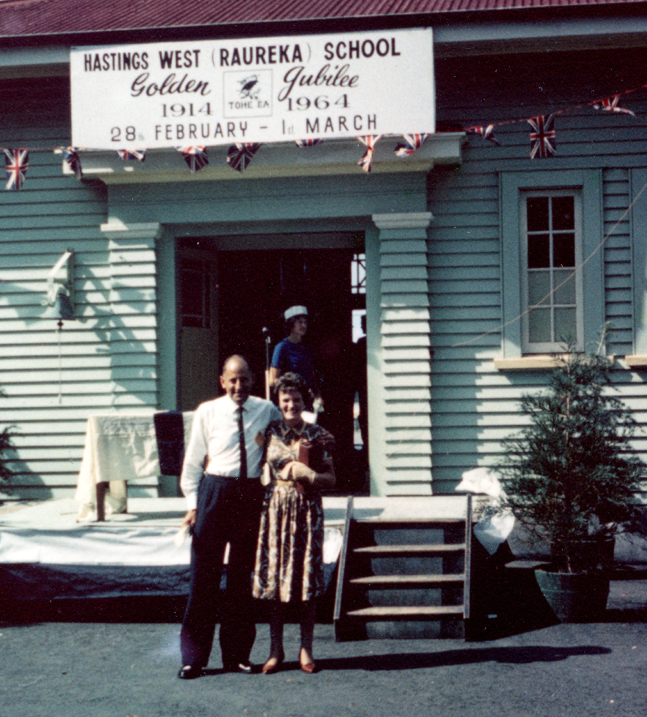 Unidentified couple outside Raureka School in 1964.
